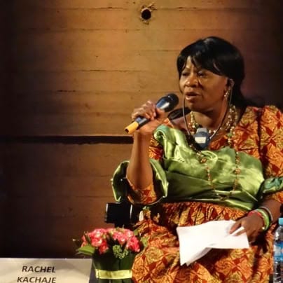 Rachel Kachaje speaking into a microphone.